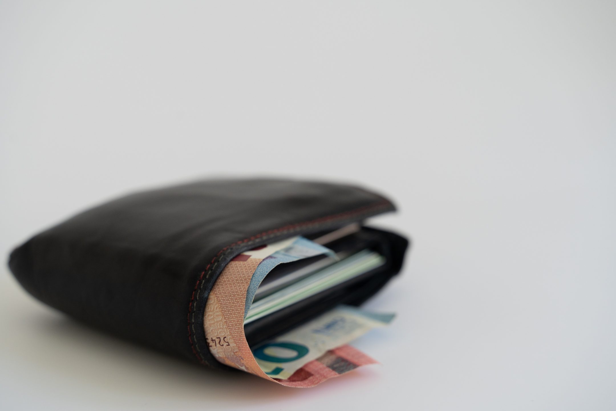 Wallet with money representing a change in spousal support