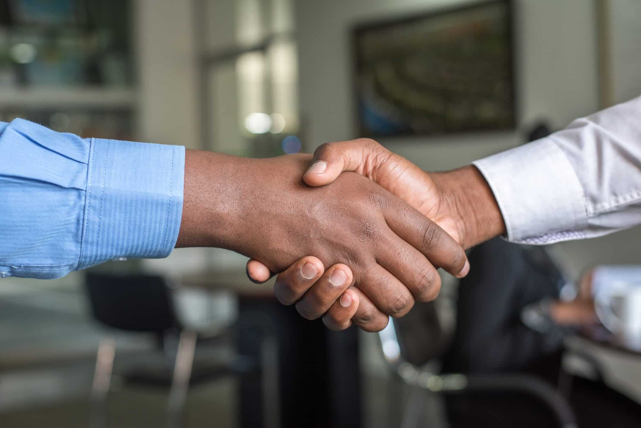 Hand-shake to represent the difference between a commercial and a residential lease agreement