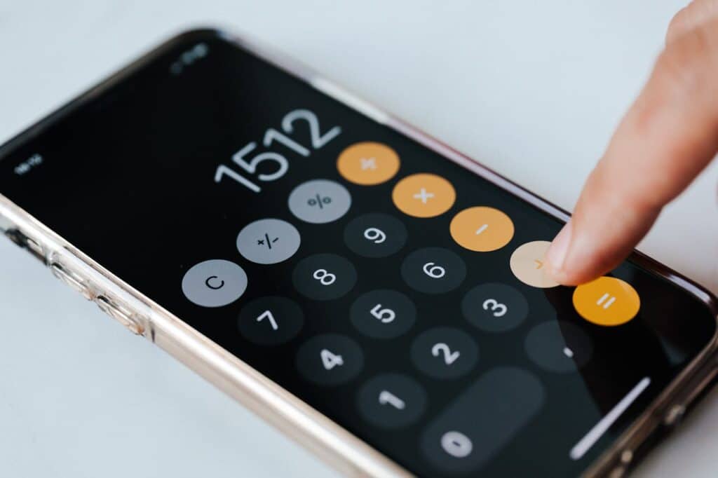 a person using an iPhone calculator
