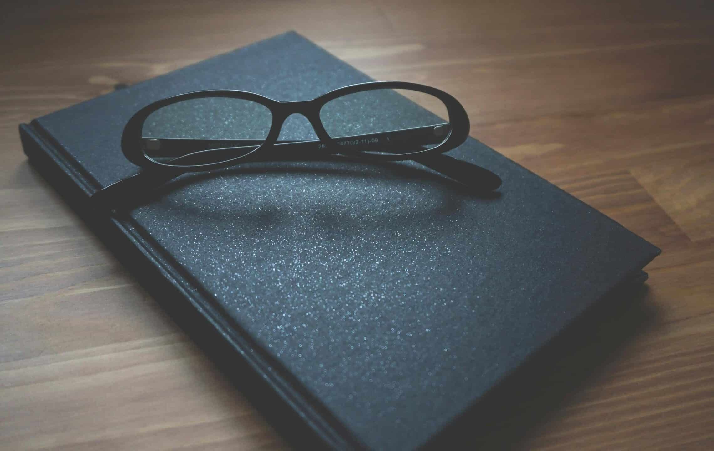 reading glasses on notebook representing trustee and executor obligations