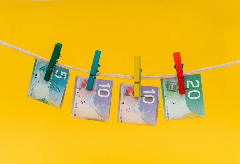 a couple of bills hanging on clothes line