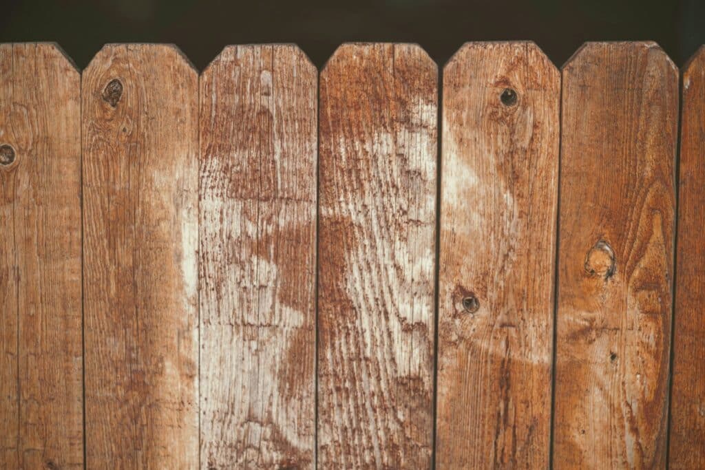 brown worn down wood fence