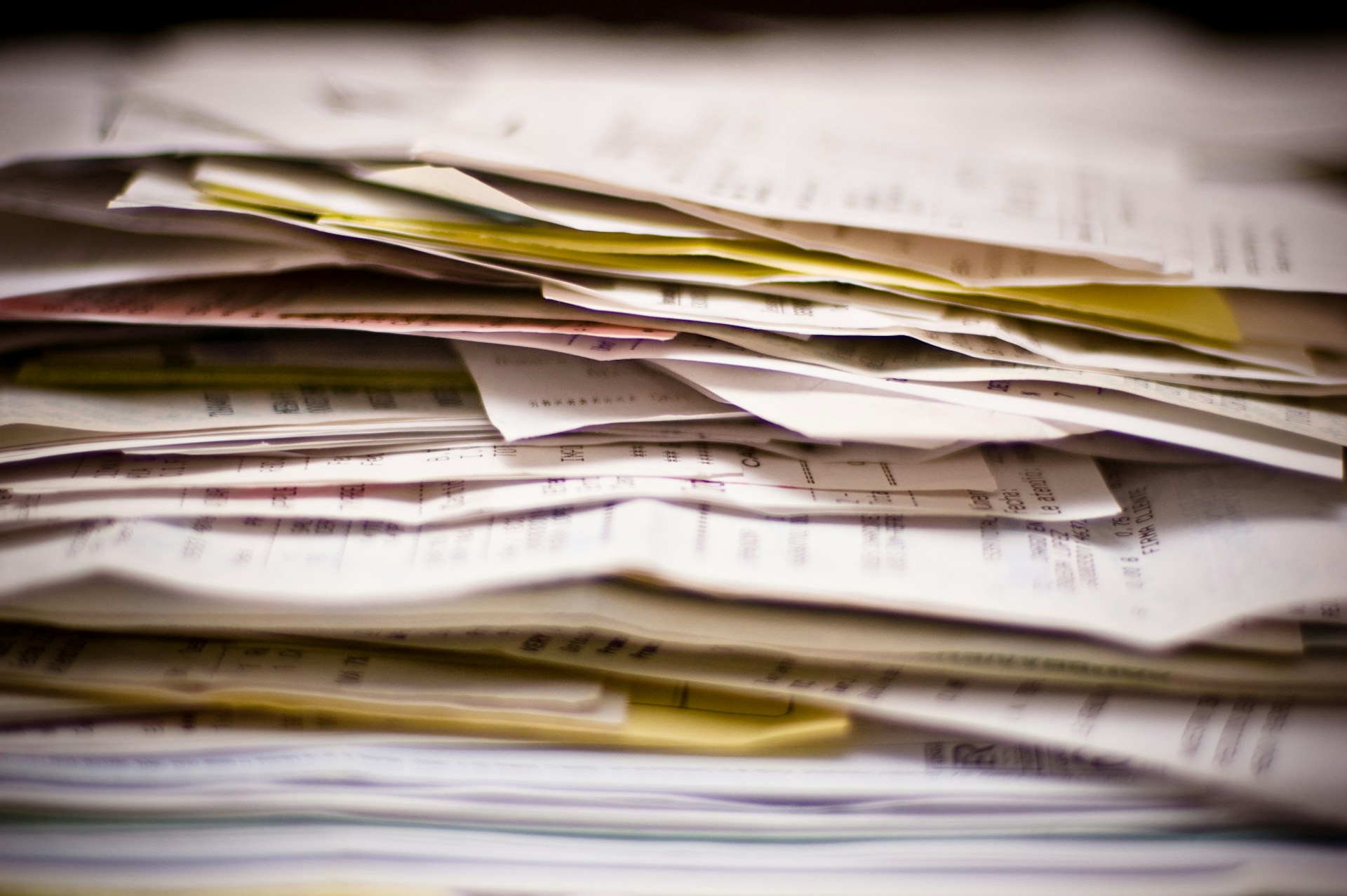 Side-view of a stack of receipts, representing financial disclosure in complex family property disputes in BC