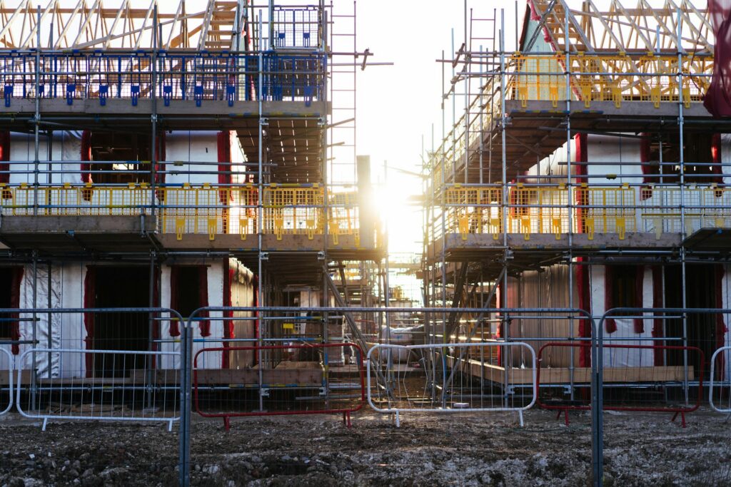 Sunset behind a residential apartment building under construction, representing relief from forfeiture and breaches of a settlement agreement in a BC developer dispute