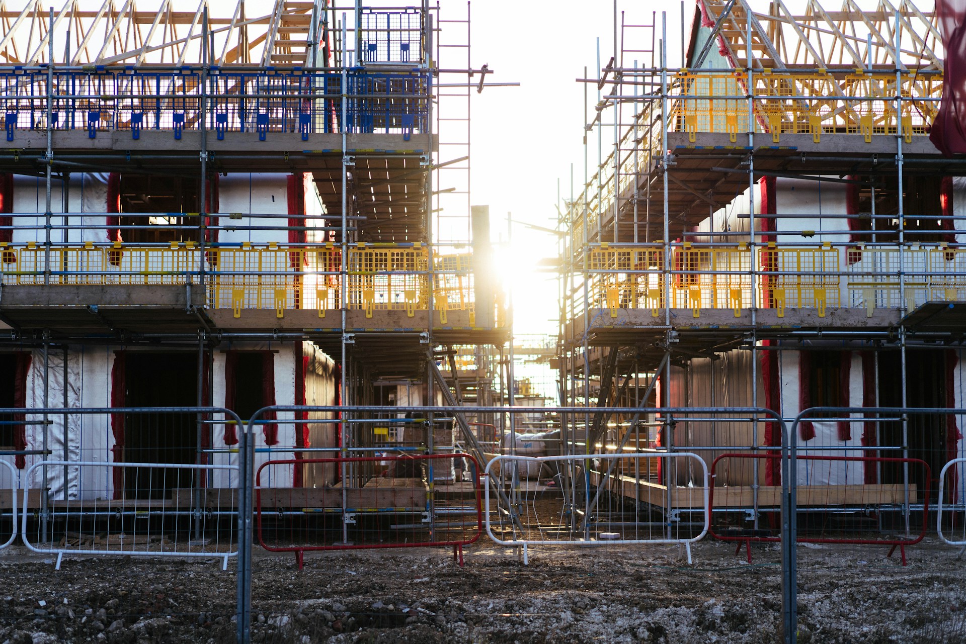 Sunset behind a residential apartment building under construction, representing relief from forfeiture and breaches of a settlement agreement in a BC developer dispute