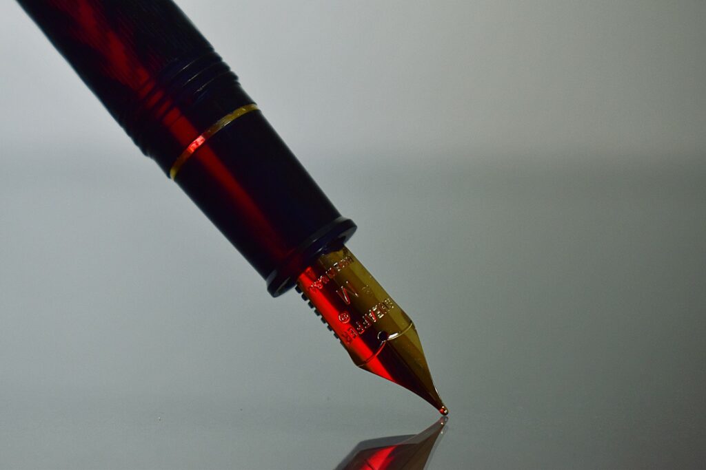 Close-up of red fountain pen, representing an invalid unsigned draft will and section 58 of the WESA in BC estate law