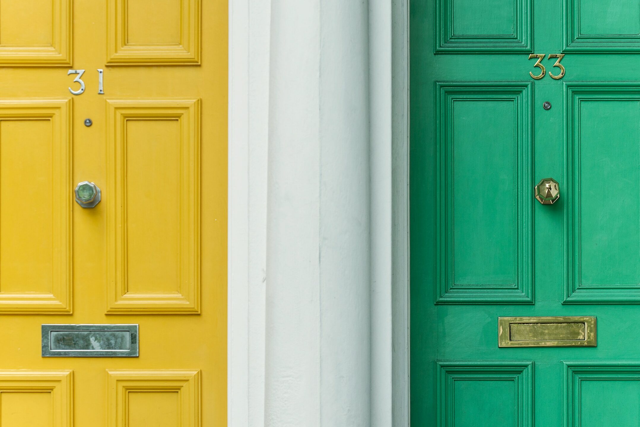 Two apartment doors side-by-side, representing neighbour disputes in Vancouver and across British Columbia and the property dispute litigation lawyers at Meridian Law Group